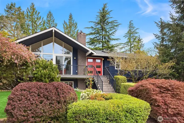 Mature landscaping surrounds the home and offers gorgeous perrenial color