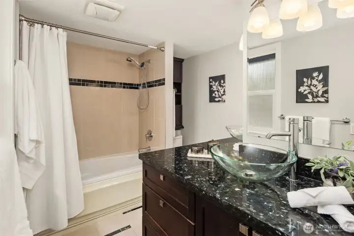 Ensuite bath with double vanity and plenty of storage space