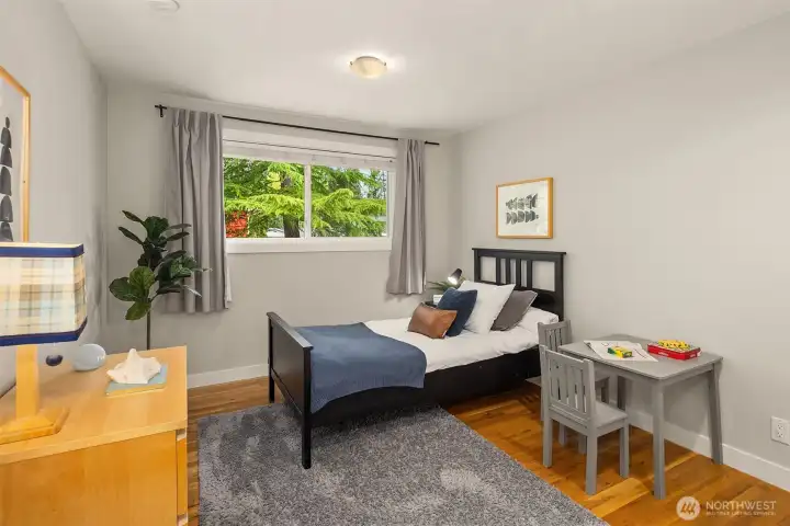 The secondary bedrooms both overlook the peaceful rear yard