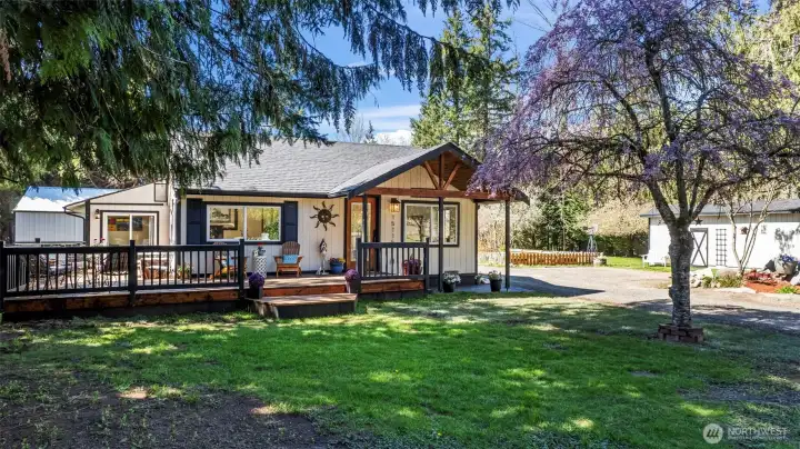 Front of Home with approx. 500 sq ft wraparound deck of summer fun and BBQ!