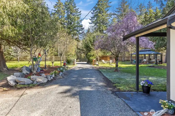 View of private gated driveway entrance looking out to Martinson Rd.