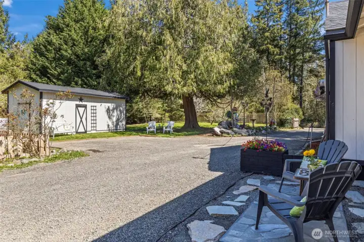 View of Well House w/ extra storage & 12,000 gallon reserve tank plus extra parking area in front!