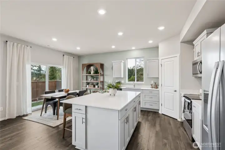 Kitchen overlooking flex space.  Finishes and options will vary.