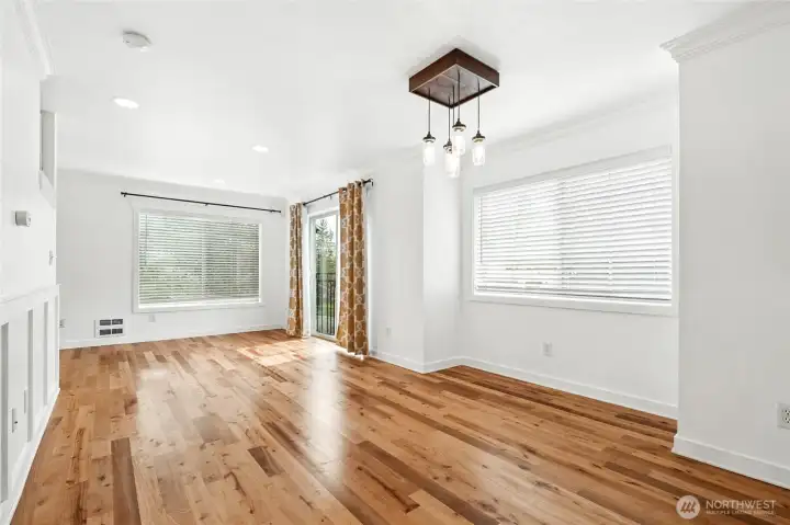 At the top of the stairs is the main living room. Real hardwood floors and sunlight from the south all day.