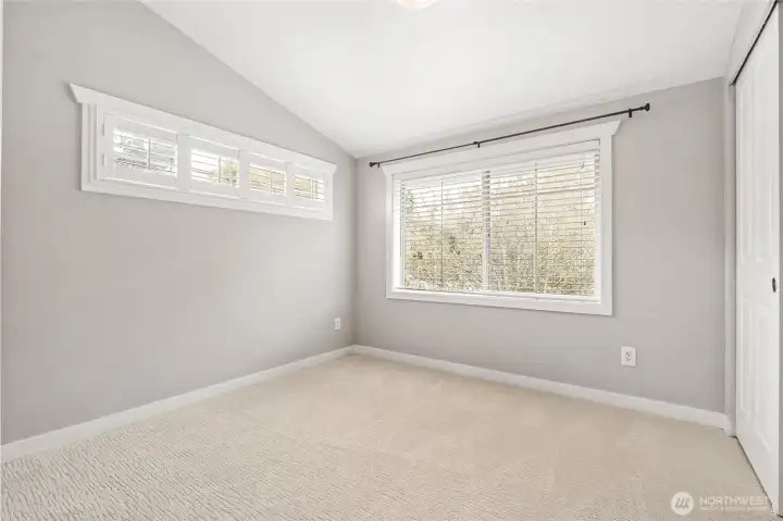 Upstairs second bedroom easily fits a Queen and could still fit a King.