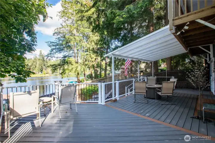 Covered deck facing the lake.  Some tree limbs are scheduled to be trimmed which will expand the view substantially.