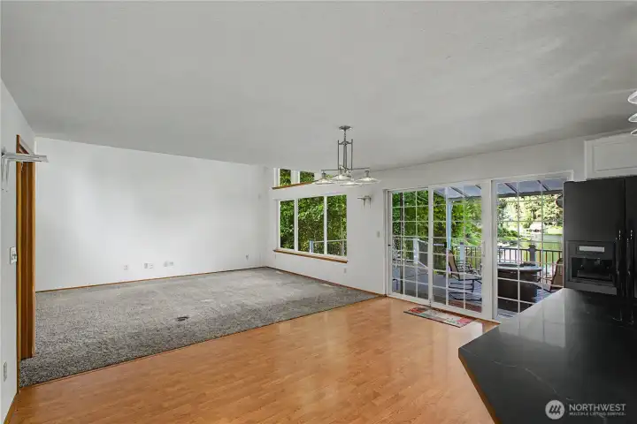 Great room with plenty of dining area and doors to the deck.