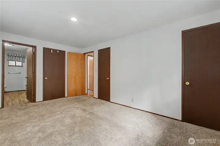 The primary bedroom on main level has 2 closets plus a walk-in closet and full bath.