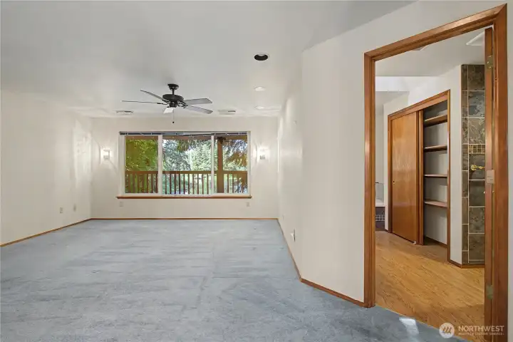 Upstairs primary with lake view.