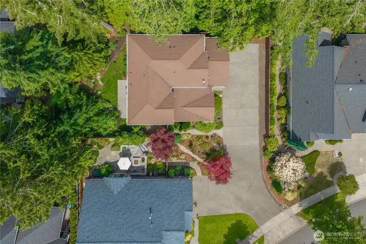This home is positioned on a private, tucked-in lot surrounded on two sides by a community green belt.
