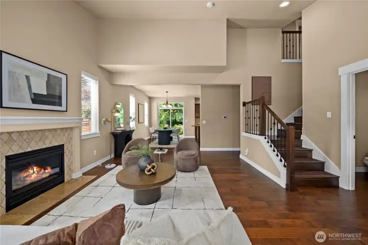 As you enter, you're instantly greeted by a spacious living room with vaulted ceilings.