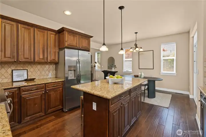 Upgraded features include the full-height tile backsplash and beautiful cherry cabinetry with crown molding.