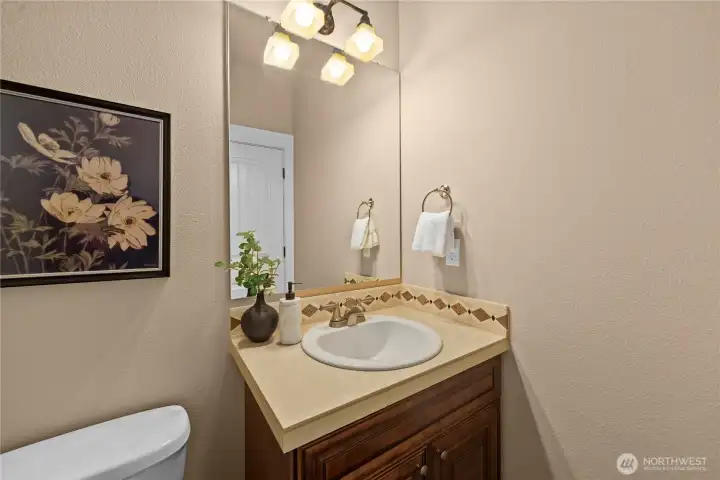 The main-floor powder room is convenient for guests.