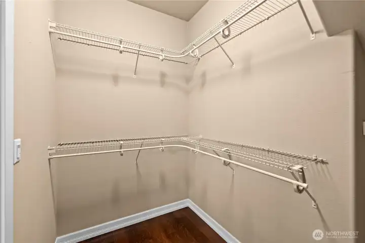 Spacious primary walk-in closet keeps it all organized.