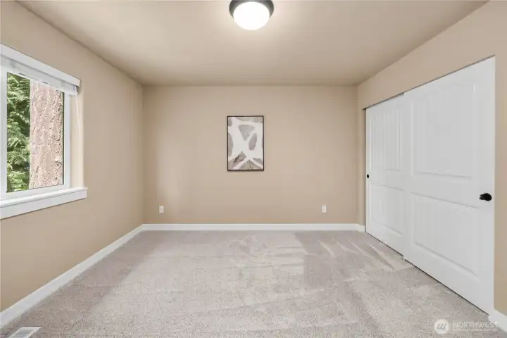Different view of bedroom 1 shows the generous closet space, up-down shades & plush carpet.