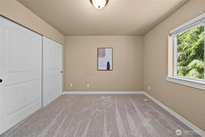 Different view of bedroom 2; also with a large closet, up-down shades & plush carpet.