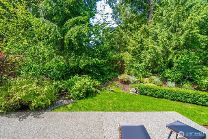 Mature vegetation provides privacy from neighbors, and the expert, native and drought-resistant landscaping make for a low-maintenance yard.