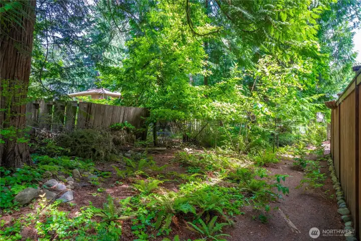 The community greenbelt surrounds the property on 2 sides, giving a buffer & added privacy.