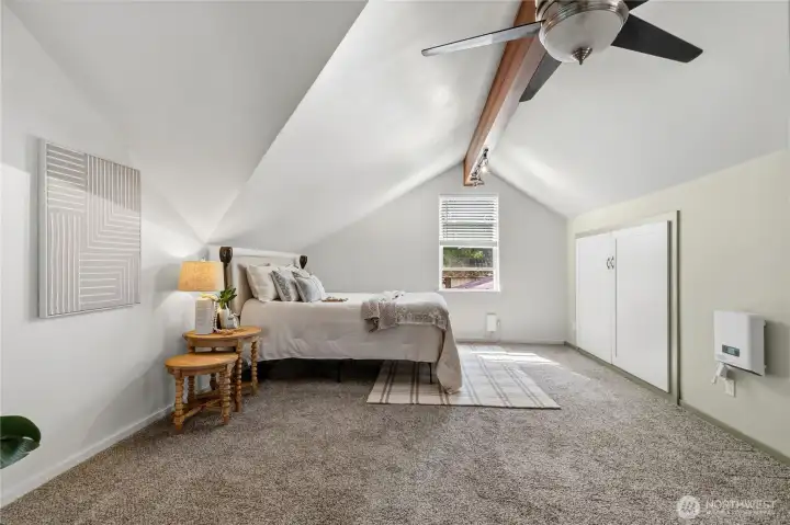 Large primary bedroom offers ample space for oversized furnishings and a relaxing sitting area. Large primary bedroom offers ample space for oversized furnishings and a relaxing sitting area.