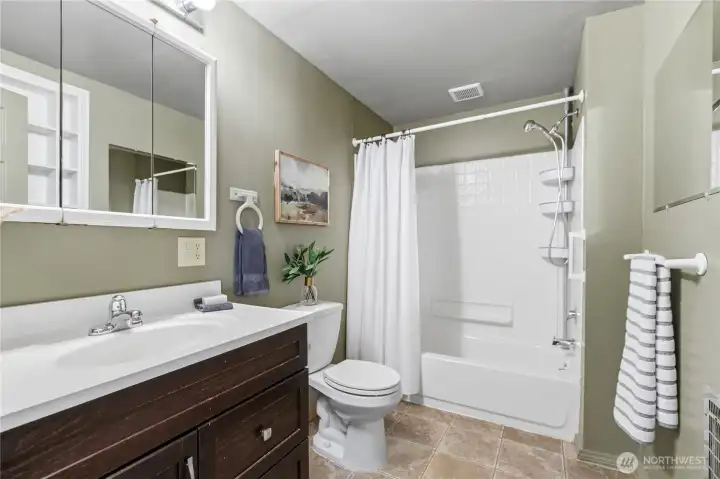 Bright, updated full bath with modern vanity, generous counter space, and a tub/shower combination designed for everyday comfort. Bright, updated full bath with modern vanity, generous counter space, and a tub/shower combination designed for everyday comfort.
