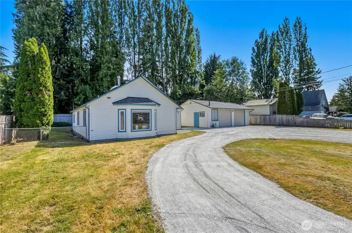 The expansive U-shaped driveway provides easy access and ample room for RVs, boats, trailers, and guests. The expansive U-shaped driveway provides easy access and ample room for RVs, boats, trailers, and guests.