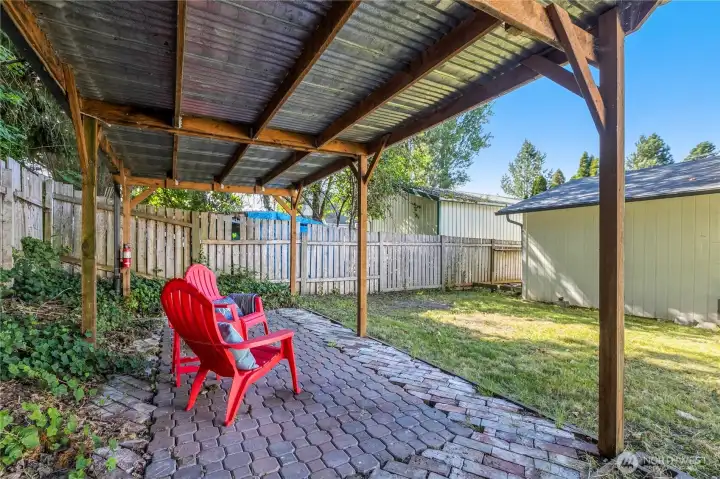 Covered patio creates a comfortable outdoor living area for relaxing or entertaining throughout the seasons. Covered patio creates a comfortable outdoor living area for relaxing or entertaining throughout the seasons.