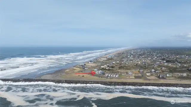 AERIAL VIEW FROM THE SOUTH TO THE NORTH SHOWING THE CONDO (RED ARROW), HOMES AND BEACHES!