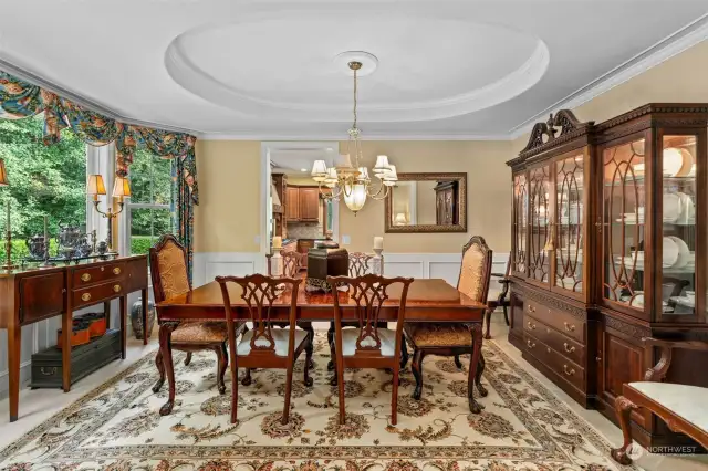 Formal dining room is fully open to the living room and features a stunning bay window view of your lovely grounds.