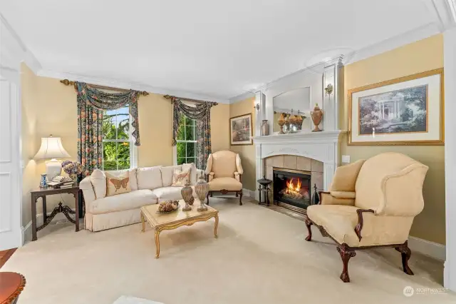 Formal living room with one of four well appointed gas fireplaces.