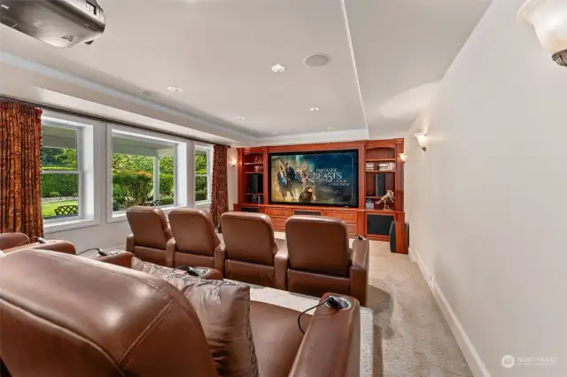 Incredible large-screen theater room! Soundproofed, with eight heated, reclining, massage chairs, delightful granite eating bar, and custom AV-equipment that all stays with the home.