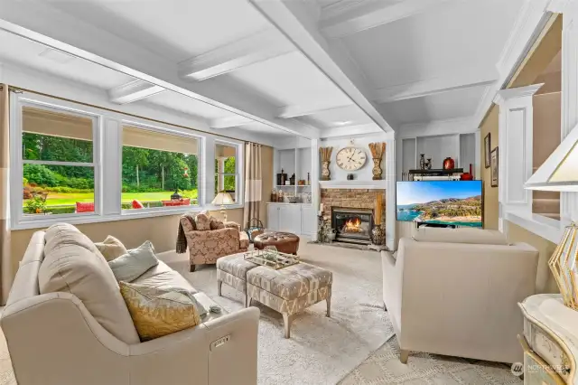 Stunning family room with coffered ceiling, custom built-in cabinetry, quality sculpted carpeting and wall-of-windows view of the backyard and 15th green. This room and the adjoining fully open main kitchen are perfectly designed to be the heart of this fine home.