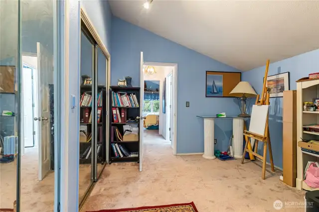 2nd bedroom with sliding doors going to additional seating area.