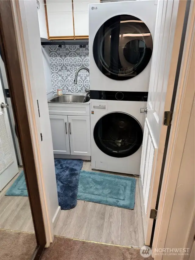 Laundry across from the downstairs bathroom.