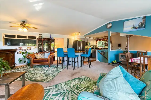 open space with a lot of natural light. Gas stove to the right.