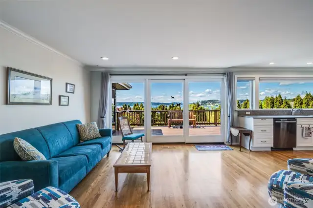 Additional family room space off of the kitchen and leading to the deck