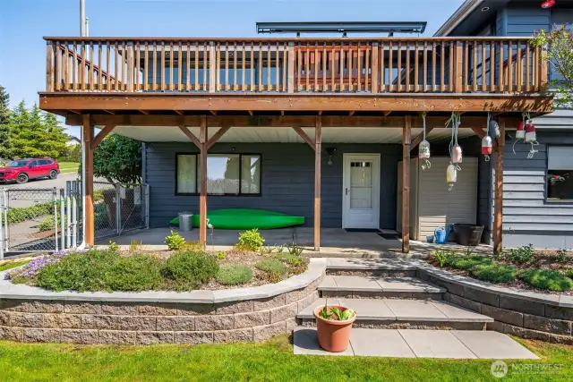 Separate entrance to the daylight basement and backyard with below deck storage space and enough room to park a car!
