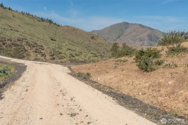 Road leading to the property on the right.