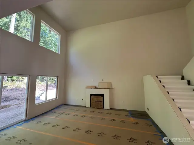Great room with 18' tall ceilings and double stacked windows