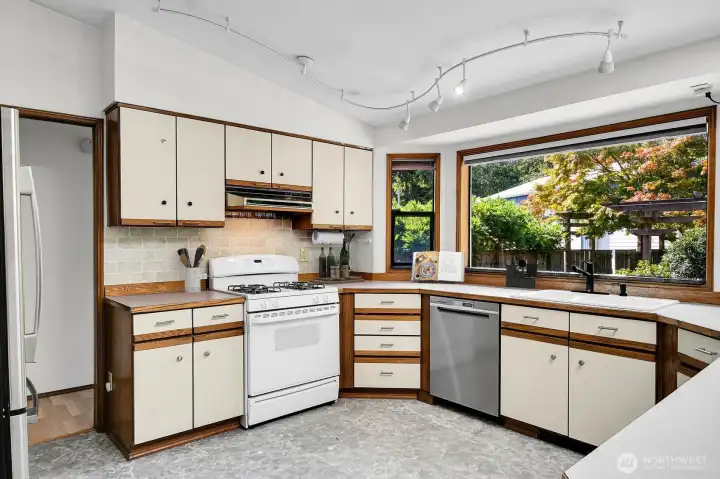 Light and bright kitchen with propane stove.