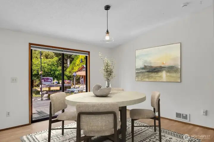 Dining area with vaulted ceilings.
