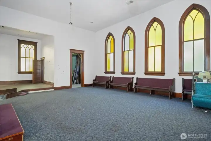 This area on the main floor can be separated with wood roll up doors and separate entrance