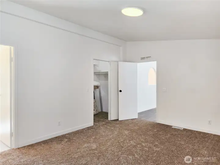 Generous walk-in closet with room to keep everything neatly organized—plenty of space for clothing, shoes, and personal treasures.