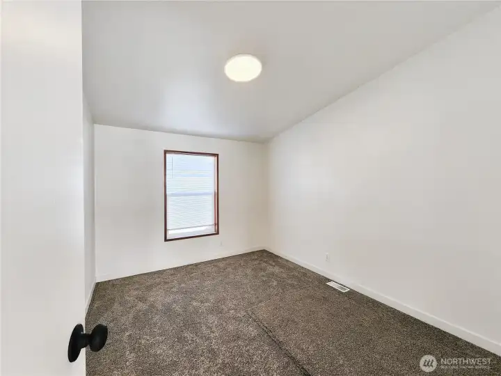 Well-sized bedroom with closet space and neutral color pallet ready for your personal touch.