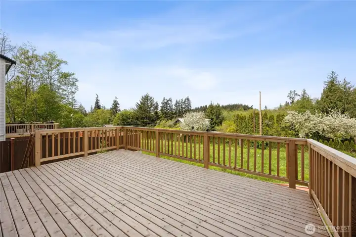 This home has a large deck overlooking open space for you to enjoy. This home has a large deck overlooking open space for you to enjoy.