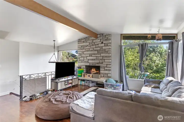 Living room with stairs down to lower level