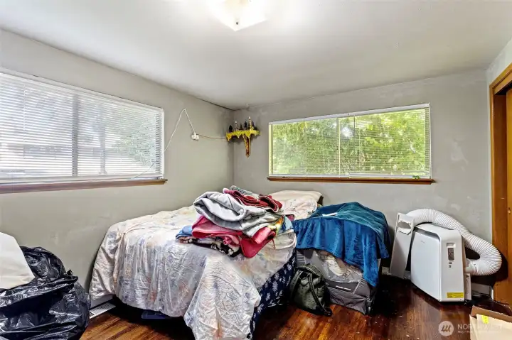 One of the roomy upstairs bedrooms with large windows