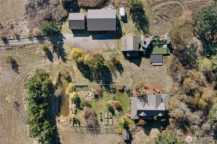 Birdseye view of the compound. You can see the garden pond to the west of the privacy berm and the fully fenced garden.