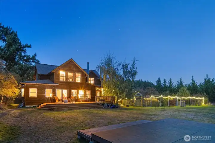 The farm house and garden at twilight.