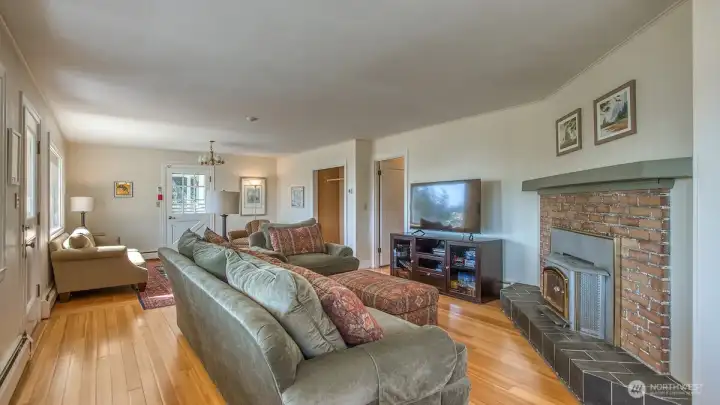Beautiful island fir floors were fully restored. Wood burning fireplace enhances the cozy living area.