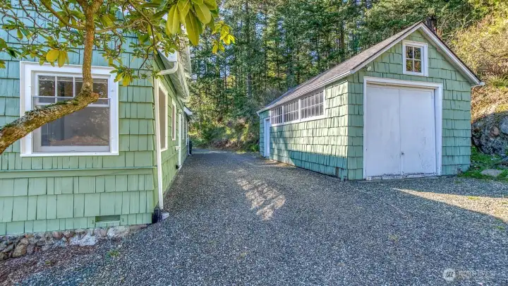 Separate garage/storage shed would make a great studio or office space.
